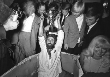Mick Meaney in coffin with trophy